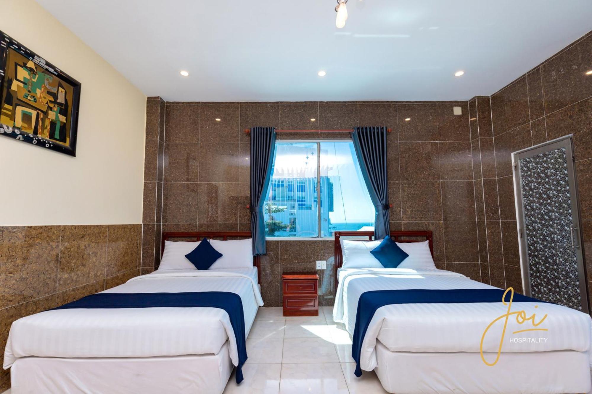 Joi Hospitality - Front Beach Вунгтау Номер фото